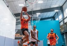 HOOP DREAMS: U-Haul International Inc. employees participate in a basketball game at a company recreation facility. COURTESY U-HAUL ­INTERNATIONAL INC.