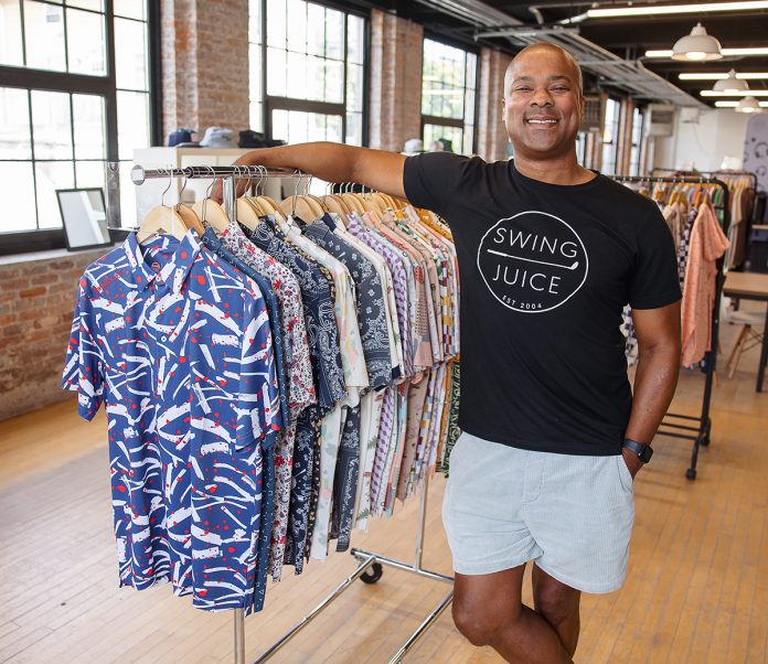 TEEING IT UP: Jon Mason, founder and owner of Swing Juice LLC in Pawtucket, says the golfing apparel company has hit its stride. It helps, he says, that the game has grown more diverse in recent years and continues to do so.
PBN PHOTO/TRACY JENKINS TEEING IT UP: Jon Mason, founder and owner of Swing Juice LLC in Pawtucket, says the golfing apparel company has hit its stride. It helps, he says, that the game has grown more diverse in recent years and continues to do so.
PBN PHOTO/TRACY JENKINS