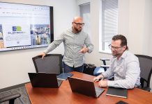 Element2 Consulting Group in an element all their own QUICK CONSULTATION: Element2 Consulting Group
co-founders Rocco Giusti, left, and Patrick Madden discuss a presentation at the company’s Lincoln office.
PBN PHOTO/TRACY JENKINS
