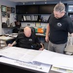Mill City Construction building its way to become leaders of the pack DESIGN WORK: Stephen Caron, left, Mill City Construction Inc. vice president, goes over design plans with Stephen Traghella, company president,
at the company’s North Smithfield office.
PBN PHOTO / TRACY JENKINS
