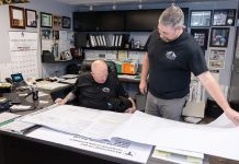 Mill City Construction building its way to become leaders of the pack DESIGN WORK: Stephen Caron, left, Mill City Construction Inc. vice president, goes over design plans with Stephen Traghella, company president,
at the company’s North Smithfield office.
PBN PHOTO / TRACY JENKINS