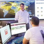 ‘Cyber range’ now putting trainees under the gun TRAINING GROUND: Douglas S. Alexander, director of the Institute for Cybersecurity & Emerging Technologies at Rhode Island College, speaks with RIC senior Miled Kalbourji in the institute’s new cyber range classroom.
COURTESY RHODE ISLAND COLLEGE