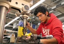 DRILLING DOWN: Mazinho Palencia, a Community College of Rhode Island graduate, works on a drill press in the school’s ­Advanced Manufacturing Lab in 2024. COURTESY COMMUNITY COLLEGE OF RHODE ISLAND