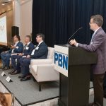 PBN summit: Tech evolution brings ‘promise, danger, uncertainty’ PROCEED WITH CAUTION: David Phillips, far left, OSHEAN Inc. chief information security officer, talks about cybersecurity in the age of artificial intelligence at Providence Business News’ Cybersecurity, AI & Tech Summit on Oct. 9. Also on the panel are, from left, Rick Norberg, Vertikal6 Inc. CEO, and Douglas Alexander, director of the Institute for Cybersecurity and Emerging Technologies at Rhode Island College. Normand Duquette, standing, senior vice president at Starkweather & Shepley Insurance Brokerage Inc., moderates.
PBN PHOTO/MIKE SKORSKI