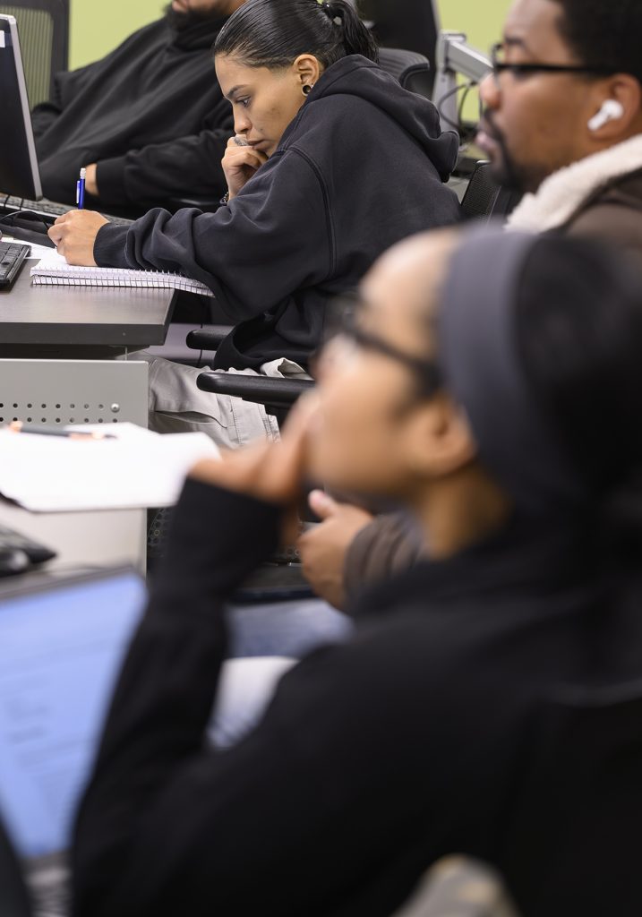 STEADY GROWTH: Vivian Orozco, top; Sean Joaseus, right; and Marianny Rosario, foreground, all of Providence, are students in a cyber training class at the Institute for Cybersecurity & Emerging Technologies at Rhode Island College. There are about 100 currently enrolled in RIC’s cybersecurity major program, with a new cohort of 70-100 students expected to enroll in the next major or minor program.
PBN PHOTO/MICHAEL SALERNO