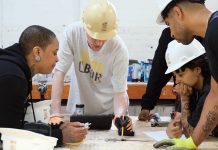 TRAINING: Quiana Ferguson, left, and Glendale Perez, center, students in a Building Futures pre-apprenticeship class that was held earlier this year from May 5 to June 6, work with Building Futures training team instructor Brook Swanson, second from right, on an exercise designed to introduce techniques used by millwrights. Pictured at right foreground is an unidentified student. COURTESY BUILDING FUTURES