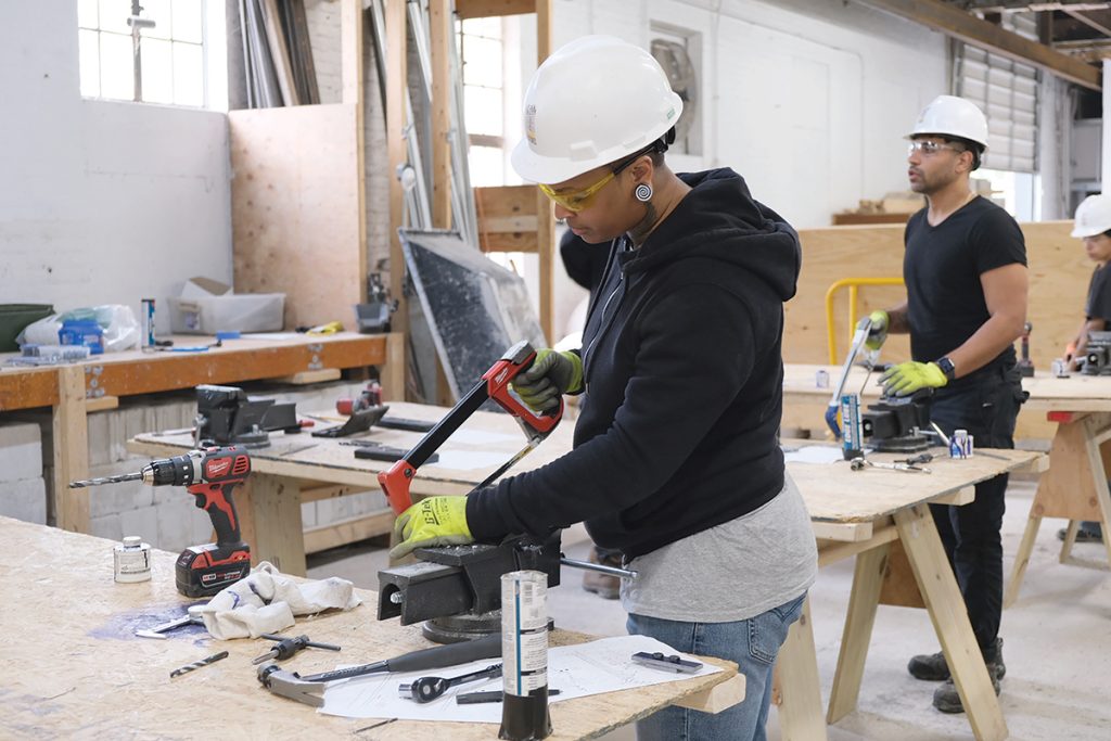 CUTTING EDGE: Quiana Ferguson, a student in the Building Futures pre-apprenticeship class held earlier this year from May 5 to June 6, works on a project. COURTESY BUILDING FUTURES