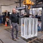 CHILLING: Robert Swift, owner and president of East Bay Ice Co. in East Providence, is pictured with some of the ice blocks the company produces. Swift says his company is unique, as it’s one of about four or five block ice plants left in the United States. PBN PHOTO/TRACY JENKINS