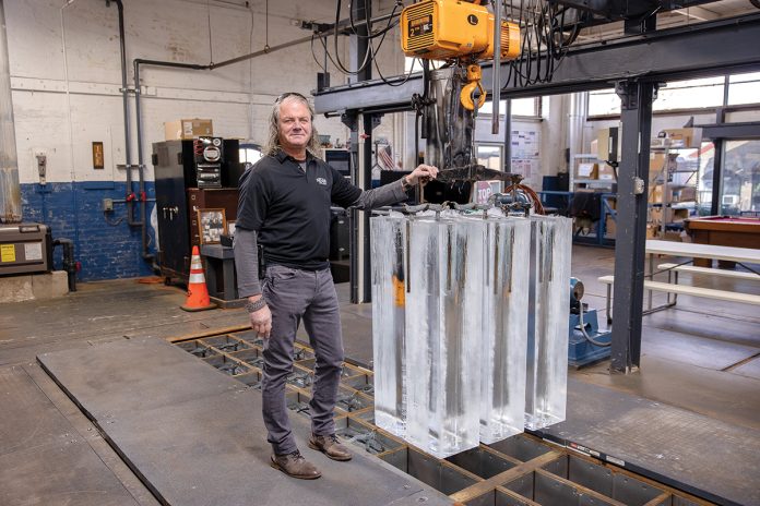 CHILLING: Robert Swift, owner and president of East Bay Ice Co. in East Providence, is pictured with some of the ice blocks the company produces. Swift says his company is unique, as it’s one of about four or five block ice plants left in the United States.
PBN PHOTO/TRACY JENKINS CHILLING: Robert Swift, owner and president of East Bay Ice Co. in East Providence, is pictured with some of the ice blocks the company produces. Swift says his company is unique, as it’s one of about four or five block ice plants left in the United States.
PBN PHOTO/TRACY JENKINS