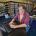 BROKEN NEWS? Outlets in search of sustainable community journalism model WORK ENVIRONMENT: Independent journalist Steve Ahlquist taps out a story on his laptop at the Rochambeau Library in Providence. He’s covered social issues for a few small local blogs and now publishes on the digital platform Substack.
PBN PHOTO/
MICHAEL SALERNO