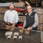 EXPANDING SERVICE: AVTECH Software Inc. CEO and President Rick Grundy, left, and Russell Benoit, marketing channel manager, show off the company’s Room Alert environment monitoring platform at its Warren facility. PBN PHOTO/JOSH EDENBAUM