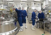 Amgen Rhode Island a hub of innovation CONTINUOUS IMPROVEMENT: Amgen Rhode Island employees such as, from left, Kagan Littlefield and Gregory Van Dijk, both level 1 senior manufacturing associates; Hanna Rouillard, level 1 manufacturing associate; and Paul Trusler, level 2 senior manufacturing associate, are always looking for ways to operate more efficiently. They are pictured at the company’s West Greenwich campus.
PBN PHOTO/ELIZABETH GRAHAM