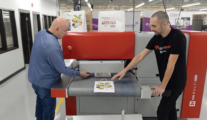 ON A ROLL: Robert Brinkman, left, assembler technician, and Ben Daubenspeck, quality assurance engineer, work with an AJ 800 overprinter at electronics manufacturer AstroNova Inc. in West Warwick.
PBN PHOTO/ELIZABETH GRAHAM ON A ROLL: Robert Brinkman, left, assembler technician, and Ben Daubenspeck, quality assurance engineer, work with an AJ 800 overprinter at electronics manufacturer AstroNova Inc. in West Warwick.
PBN PHOTO/ELIZABETH GRAHAM