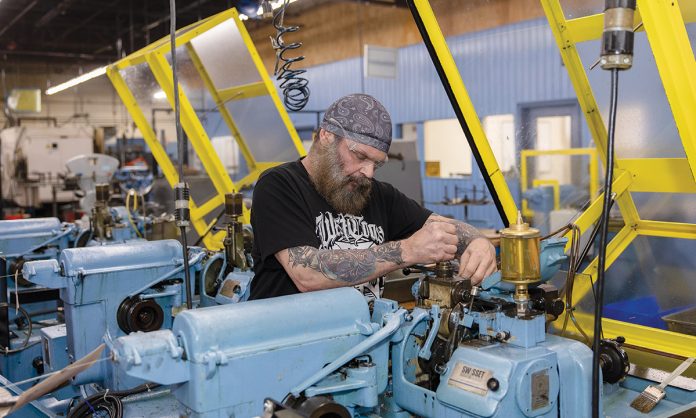 ATTENTION TO DETAIL:
Ray Scungio, Escomatic supervisor, works on an Escomatic screw machine at Smithfield-based Groov-Pin Corp., which produces fasteners, grooved pins and Tap-Lok threaded inserts that are used in the automotive, aerospace and die casting industries.
PBN PHOTO/TRACY JENKINS ATTENTION TO DETAIL:
Ray Scungio, Escomatic supervisor, works on an Escomatic screw machine at Smithfield-based Groov-Pin Corp., which produces fasteners, grooved pins and Tap-Lok threaded inserts that are used in the automotive, aerospace and die casting industries.
PBN PHOTO/TRACY JENKINS
