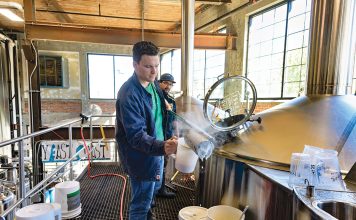 SOBER REFLECTION: With the craft beer boom over, breweries look for answers to maturing market, changing tastes TESTING: Brewer Matt Von Holten, foreground, and cellarman Eric Gonzalez, who oversees the day-to-day post-brewing processes, test the wort – the liquid extracted from the mashing process when brewing beer – at The Guild Brewery in Pawtucket.
PBN PHOTO/MICHAEL SALERNO
