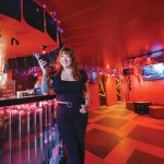 SUPPORTIVE ATMOSPHERE: Analise Rossi, manager and bartender at The Boombox in Providence, says there’s often a group of regulars at the karaoke lounge always applauding and cheering on the performers.  PBN PHOTO/MICAHEL SALERNO