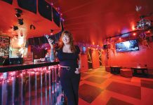 Karaoke bar stands out in crowded Providence nightlife scene SUPPORTIVE ATMOSPHERE: Analise Rossi, manager and bartender at The Boombox in Providence, says there’s often a group of regulars at the karaoke lounge always applauding and cheering on the performers.
PBN PHOTO/MICAHEL SALERNO