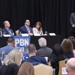 PBN Health Summit panel: Could R.I. fix doctor shortage by looking to other states? HEALTHY TALK: Dr. Edward McGookin, third from the left, speaks during a panel discussion at Providence Business News’ Fall Health Care Summit: Shaping the Future of Care on Oct. 30. McGookin is chief of primary care at Brown Health Medical Group Primary Care. With him during the first of two panel discussions are, from left, Victoria Williams, assistant professor of health care administration at Rhode Island College; Dr. Roger Mitty, president and chief operating officer of Care New England Medical Group; and Sen. Pamela Lauria, a nurse practitioner. Moderating is PBN Editor Michael Mello, standing.
PBN PHOTO/MIKE SKORSKI