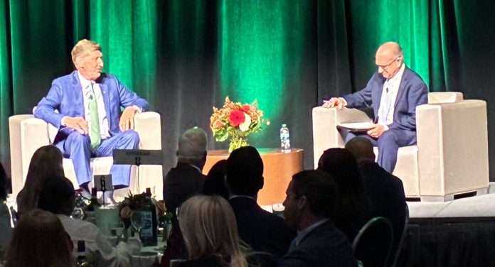 CITIZENS FINANCIAL Group Inc. Chairman and CEO Bruce Van Saun, left, speaks with Providence Chamber of Commerce Chairman Rick Metters during a 