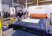FINAL TOUCHES: Manufacturing technician Noel Laflamme sets up a job on the laser cutter at metal fabricator Ward’s Manufacturing LLC in Warren. PBN PHOTO/MICHAEL SALERNO