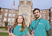 NEW ­TRAINING: Chloe Johnson, of Portland, Ore., and Jack Pawlowski, of Taunton, are head residential assistants at Providence College. Over the summer, RAs at universities across Rhode Island received training on how to administer the opioid overdose reversal medication naloxone. Johnson and Pawlowski are holding naloxone nasal spray kits. PBN PHOTO/­MICHAEL SALERN­O