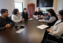 City Personnel’s DEI philosophy shapes Rhode Island’s workforce PERSONNEL MEETING: City Personnel employees meet at the staffing organization’s office in Providence. Pictured, from left, are Daniel Apajee, sourcing specialist; Adora Andrade, recruiting coordinator; Dawn Apajee, founder and president; Zach Gagnon, marketing manager; and recruiting specialists Britt Phillips and Soledad Lacayo.
PBN PHOTO/MICHAEL SALERNO