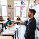 FINANCE FUNDAMENTALS: Bryan Hoff­man, a financial services certified professional with Gorra Financial Group, teaches financial literacy to a special education class at East Providence High School through Won Strategy, a program that introduces high school students to the fundamentals of business. PBN PHOTO/MICHAEL SALERNO