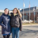 KEEPING WATCH: Cassie Voll, left, and Brooke Cure, both of Newport, are founders of Moms over Margins, an advocacy group fighting to prevent the closure of Newport Hospital’s Noreen Stonor Drexel Birthing Center. Voll and Cure are standing outside the hospital.  PBN PHOTO/DAVID HANSEN