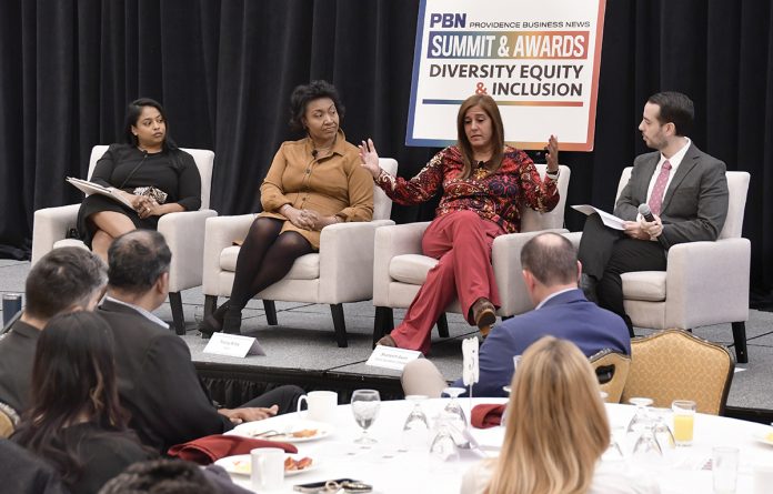 MAKING A POINT: Shameem Awan, second from right, senior assistant vice president of Amica Mutual Insurance Co., speaks during a panel discussion at Providence Business News’ 2025 Diversity, Equity and Inclusion Summit and Awards Program on Dec. 4. Also on the panel, from left, are Monika P. Zuluaga, CEO and president of the Northern Rhode Island Chamber of Commerce; Tracey G. Wiley, executive director of diversity, equity and inclusion at Bally’s Corp.; and moderator Kevin Matta, senior director of people and culture at United Way of Rhode Island Inc. PBN PHOTO/MIKE SKORSKI   