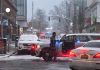 LAW ENFORCEMENT OFFICIALS continue to reroute traffic in the neighborhood surrouned the shooting scene at Brown University on Sunday. / AP PHOTO/STEVEN SENNE