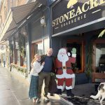 FESTIVE FEAST: Stoneacre Hospitality Group co-owners Nicole Canning and chef Christopher Bender stand outside one of their restaurants, Stoneacre Brasserie in Newport, which will be one of a handful of Newport restaurants that will be open and serving on Christmas Day this year. COURTESY STONEACRE EXPERIENCES  