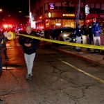 EMERGENCY PERSONNEL gather at Thayer and Waterman streets in Providence on Dec. 13, after the fatal shooting at Brown University. Business owners in the area have noticed a decline in sales since the shooting, beyond the usual drop when students leave for winter break. / AP FILE PHOTO/MARK STOCKWELL