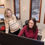 PLANNING AHEAD: Jennifer Mega, right, managing partner at Mega Professionals LLC, says the state of Rhode Island should focus on workforce development and strategic investments to protect against a fluctuating economy and rising unemployment rates. She is pictured with Alex Pettit, managing partner, at their East Providence office. PBN PHOTO/TRACY JENKINS