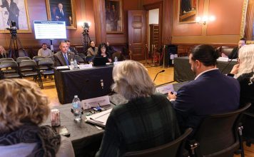 EARLY START: The Special Legislative Commission to Study Housing Affordability holds a hearing at the Statehouse in December, weeks ahead of the the 2026 legislative session. Testifying before the commission are Randy R. Rossi, left, Rhode Island League of Cities and Towns executive director, and Ashley Sweet, immediate past president of the Rhode Island Chapter of the American Planning ­Association. PBN PHOTO/MICHAEL SALERNO