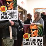 SIGNS OF THE TIMES? People opposed to a data center proposal at the former Pennhurst state hospital grounds in Spring City, Pa., brought signs to express their opposition to the plan at an East Vincent Township supervisors meeting on Dec. 17.   AP FILE PHOTO/MARC LEVY