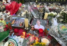Brown University launches healing, recovery initiative after deadly campus shooting FLOWERS AND CANDLES surround photos of Mukhammad Aziz Umurzokov, an 18-year-old freshman from Brandermill, Va., and Ella Cook, a 19-year-old sophomore from a suburb of Birmingham, Ala., in front of a Brown University gate in Providence on Dec. 17. Both were killed in the campus shooting on Dec. 13. / AP FILE PHOTO/LEAH WILLINGHAM