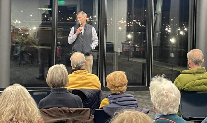 ALBERT DAHLBERG, assistant vice president of the office of government and community relations at Brown University, addresses members of the community at the Jewelry District Association January Meeting at the CIC building. PBN PHOTO/ VEER MUDAMBI