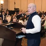 READING THE SIGNS: Thomas Tzitzouris, head of fixed-income research at financial services firm Strategas Research Partners, reviews his 2026 economic outlook for the attendees of Providence Business News’ ­Economic Trends Summit on Jan. 22.  PBN PHOTO/MIKE SKORSKI