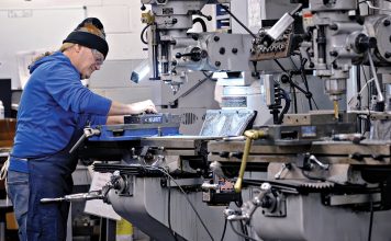 HANDIWORK: Tool maker Bobby Bianca operates a milling machine on the production floor at Warwick Hanger Co. in Westerly.  PBN PHOTO/MICHAEL SALERNO