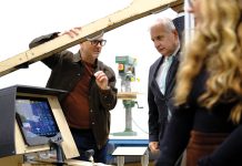 TEST SUBJECT: Justin Sirotin, left, co-founder of Octo Product Development Inc., shows U.S. Sen. Jack Reed a mockup of a cockpit used by Regent Craft Inc. at Octo’s design lab in Providence. Regent is developing 12-passenger seagliders at its North Kingstown headquarters.  COURTESY OCTO PRODUCT DEVELOPMENT INC.