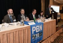 KARL WADENSTEN, third from the left, CEO and president VIBCO Inc., speaks at the Providence Business News Workforce Development Summit on Thursday morning. Also on the first of two panels is, from left, Matthew Weldon, director of the R.I. Department of Labor and Training; Farouk Rajab, CEO and president of the Rhode Island Hospitality Association and the Rhode Island Hospitality Education Foundation; and Rosa Brito, workforce development manager for Brown University Health. PBN Editor Michael Mello, standing, moderated. PBN PHOTO/MIKE SKORSKI