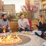 OPEN SPACE: Guests enjoy a meal at Rooftop at Providence G, one of several venues in Rhode Island that offer dining and bar space on a rooftop.  COURTESY ­PROVIDENCE ­WARWICK ­CONVENTION & ­VISITORS BUREAU/NICK MILLARD