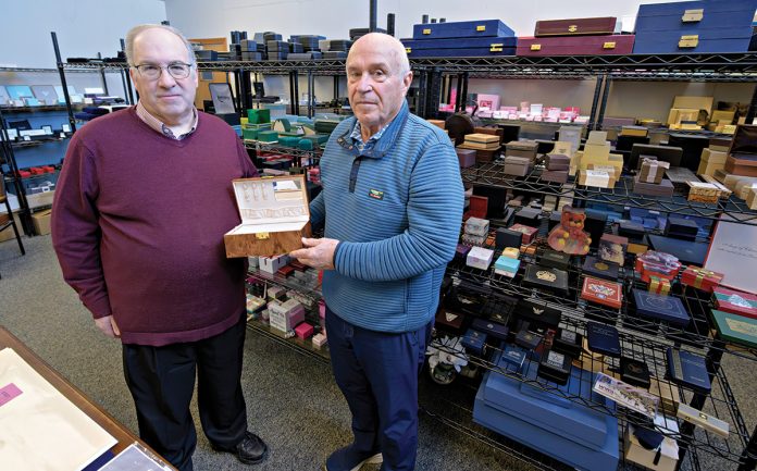 CUSTOM DESIGN: Jon Backner, left, vice president and chief financial officer at jewelry box and packaging manufacturer Fuller Box Co. in Central Falls, and Tom Mercer, vice president of sales, show off one of the company’s products.   PBN PHOTO/MICHAEL SALERNO