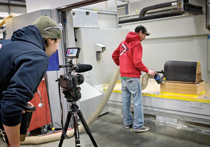 ACTION: Composite manufacturer Moore Brothers Co. in Bristol uses social media to market its business. Floor technician and multimedia creator Jacob Rapoza, left, records computer numerical control programmer and operator Benjamin Calssen as he works on the CMS Ares 5 axis CNC Gantry machine.
PBN PHOTO/MICHAEL SALERNO ACTION: Composite manufacturer Moore Brothers Co. in Bristol uses social media to market its business. Floor technician and multimedia creator Jacob Rapoza, left, records computer numerical control programmer and operator Benjamin Calssen as he works on the CMS Ares 5 axis CNC Gantry machine.
PBN PHOTO/MICHAEL SALERNO