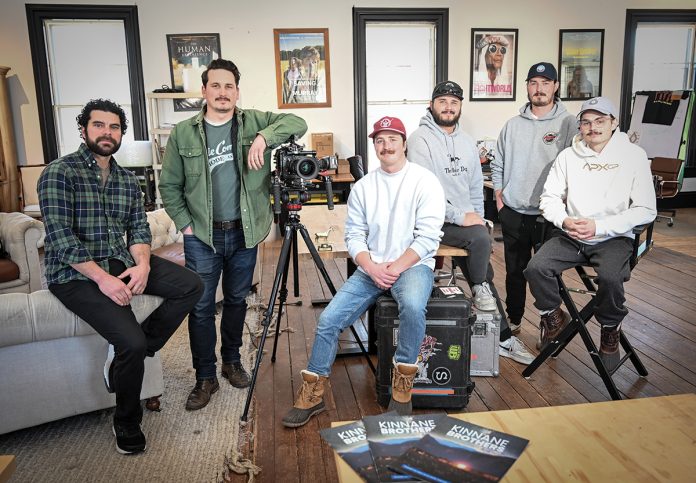 FILM FAMILY: The Kinnane Brothers film production company has worked on several projects with Kevin James, including their latest film, “Solo Mio,” which was released Feb. 6. Pictured from left in their Little Compton studio are brother-in-law Jeffrey Azize and brothers Daniel Kinnane, Brendan Kinnane, Patrick Kinnane, Peter Kinnane and John Kinnane.  PBN PHOTO/DAVID HANSEN