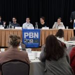 TED WILLIAMS, far left, president of Senesco Marine LLC, speaks during one of the panel discussions at Providence Business News' 2026 Emerging Industries Summit on Wednesday. Also on the panel is, from left, Ben Sorkin, CEO of Flux Marine Ltd.; Jason Noel, operations executive at Juice Robotics LLC; Linda Larsen, maritime and industry engagement manager at Polaris Tech Bridge; and Daniela Fairchild, chief strategy officer at R.I. Commerce Corp. PBN Editor Michael Mello, standing, is moderating. / PBN PHOTO/MIKE SKORSKI