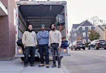 SUPPORT SYSTEM: Trent Manning, center, is the founder and owner of Down The Road Movers LLC, a Black-owned moving company that he launched to support formerly incarcerated individuals. Pictured with Manning, from left, are foremen/drivers Genesis Harney and Ryan Fogarty. PBN PHOTO/MICHAEL SALERNO