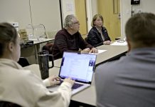 Could Scituate primary care safety net be an answer for R.I.? TALKING HEALTH CARE: John Marchant, center left, leads a recent meeting of the Scituate Health Alliance, along with alliance treasurer Wendy Marchant, center right; secretary Courtney Cheng, foreground left; and Jared R. Neirinckx.
PBN PHOTO/MICHAEL SALERNO