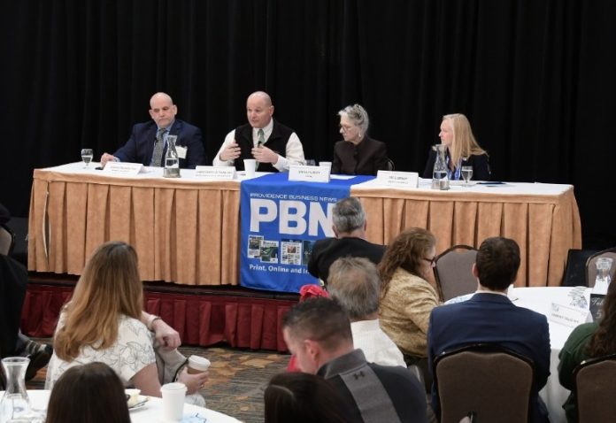 0402summitpanel2 DR. CHRISTOPHER OTTIANO, second from left, interim chief medical officer and medical director at Neighborhood Health Plan of Rhode Island, speaks during one of two panel discussions during Providence Business News' Health Care Summit at Marriott Providence on Thursday. Also on the panel are, from left, Joseph Trunzo, associate director of Bryant University's School of Health and Behavioral Sciences; Linda Hurley, CODAC Inc. CEO and president; and Meghan Grady, Meals on Wheels of RI Inc. executive director. / PBN PHOTO/MIKE SKORSKI