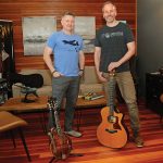 DYNAMIC DUO: Erik Brine, left, and Rob Raymond, co-founders of Operation Encore, at their office in Jamestown. The nonprofit provides opportunities for veteran and active-duty singer-songwriters and musicians to take their music to the next level, offering artist development, professional recording and educational services. PBN PHOTO/­ELIZABETH GRAHAM